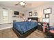 Bedroom with a queen bed, desk and ceiling fan at 730 E Michigan St # 139, Orlando, FL 32806