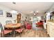Bright dining area with a round table and hardwood floors at 730 E Michigan St # 139, Orlando, FL 32806