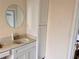 Bathroom with white vanity, large mirror, and storage at 762 Rosalie Way, Winter Springs, FL 32708