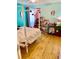Charming bedroom with light wood floors and a white four-poster bed at 762 Rosalie Way, Winter Springs, FL 32708