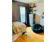 Bedroom with wood floors, large window, and dresser at 762 Rosalie Way, Winter Springs, FL 32708