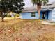 Front yard with mature trees and landscaping at 762 Rosalie Way, Winter Springs, FL 32708
