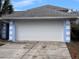 Attached garage with white door, providing ample parking space at 762 Rosalie Way, Winter Springs, FL 32708