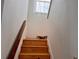 Wooden staircase leading to the upper level at 762 Rosalie Way, Winter Springs, FL 32708