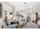 Spacious living room with hardwood floors and ample natural light at 9095 Laurel Ridge Dr, Mount Dora, FL 32757