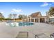 Community pool with a clubhouse and lounge chairs at 9095 Laurel Ridge Dr, Mount Dora, FL 32757