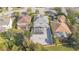 Aerial view showing home with pool, patio, and basketball court at 9168 Lake Avon Dr, Orlando, FL 32829