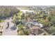 Aerial view of house and surrounding neighborhood with pond at 9168 Lake Avon Dr, Orlando, FL 32829