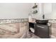 Modern bathroom with a black vessel sink and mosaic tile accents at 9168 Lake Avon Dr, Orlando, FL 32829