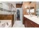 Elegant bathroom with double vanity, soaking tub, and walk-in shower at 9168 Lake Avon Dr, Orlando, FL 32829