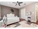 Bedroom with a queen bed, dresser, and a desk at 9168 Lake Avon Dr, Orlando, FL 32829