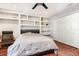 Bright bedroom with built-in shelves and hardwood floors at 9168 Lake Avon Dr, Orlando, FL 32829