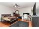 Bedroom with a large bed, TV and desk at 9168 Lake Avon Dr, Orlando, FL 32829