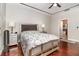 Comfortable bedroom with hardwood floors, large bed, and ensuite bathroom access at 9168 Lake Avon Dr, Orlando, FL 32829