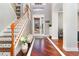 Elegant entryway with hardwood floors, staircase, and high ceilings at 9168 Lake Avon Dr, Orlando, FL 32829
