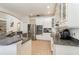 Spacious kitchen with white cabinets, granite countertops, and stainless steel appliances at 9168 Lake Avon Dr, Orlando, FL 32829