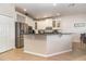 Modern kitchen with stainless steel appliances and a large kitchen island at 9168 Lake Avon Dr, Orlando, FL 32829
