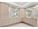 Elegant bathroom with double vanity, modern fixtures, and glass tile accents at 10230 Park Ridge Gotha Rd, Windermere, FL 34786