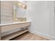 Modern bathroom with floating vanity and a large mirror at 10230 Park Ridge Gotha Rd, Windermere, FL 34786