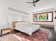 Comfortable bedroom with built-in shelving and a view of the outdoors at 10230 Park Ridge Gotha Rd, Windermere, FL 34786