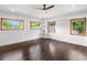 Bright bedroom with hardwood floors and large windows at 10230 Park Ridge Gotha Rd, Windermere, FL 34786