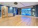Finished game room with wet bar and unique geometric feature wall at 10230 Park Ridge Gotha Rd, Windermere, FL 34786