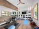 Home gym with various equipment and large windows at 10230 Park Ridge Gotha Rd, Windermere, FL 34786