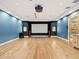 State-of-the-art home theater with projector, large screen, and surround sound at 10230 Park Ridge Gotha Rd, Windermere, FL 34786