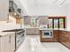 Modern kitchen with stainless steel appliances and granite countertops at 10230 Park Ridge Gotha Rd, Windermere, FL 34786
