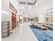 Spacious living area with high ceilings, large windows, and stylish furniture at 10230 Park Ridge Gotha Rd, Windermere, FL 34786