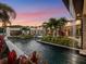 Stunning pool with waterfall feature at sunset at 10230 Park Ridge Gotha Rd, Windermere, FL 34786