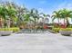Relaxing pool with spacious patio and tropical plants at 10230 Park Ridge Gotha Rd, Windermere, FL 34786