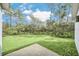 Large backyard featuring a grassy area and patio at 139 Malauka Pass, Ocklawaha, FL 32179