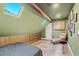 Charming bedroom with skylights and a wood accent wall at 2330 Westminster Ct, Winter Park, FL 32789