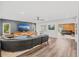 Open concept Gathering room with sectional sofa, hardwood floors, and access to backyard at 2330 Westminster Ct, Winter Park, FL 32789