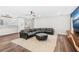 Spacious Gathering room includes sectional sofa and large TV above custom media console at 2330 Westminster Ct, Winter Park, FL 32789