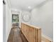 Hallway with hardwood floors and modern wood accents at 2330 Westminster Ct, Winter Park, FL 32789