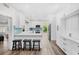 Modern kitchen with white cabinets, quartz countertops and breakfast bar at 2330 Westminster Ct, Winter Park, FL 32789