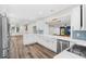 Modern kitchen featuring white cabinets, quartz countertops, and stainless steel appliances at 2330 Westminster Ct, Winter Park, FL 32789