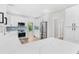 Bright kitchen boasts white cabinets, quartz countertops, and stainless steel appliances at 2330 Westminster Ct, Winter Park, FL 32789