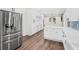 Stainless steel refrigerator and white cabinetry highlight this spacious kitchen at 2330 Westminster Ct, Winter Park, FL 32789