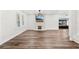 Open living area with stone fireplace, hardwood floors, and chandelier at 2330 Westminster Ct, Winter Park, FL 32789