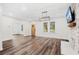Spacious living room with hardwood floors, fireplace and large TV at 2330 Westminster Ct, Winter Park, FL 32789