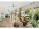 Bright sunroom with hardwood floors and backyard access at 2330 Westminster Ct, Winter Park, FL 32789
