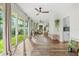 Spacious sunroom with hardwood floors and view of backyard at 2330 Westminster Ct, Winter Park, FL 32789