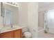 Bathroom features a vanity, toilet, and shower/tub combo at 246 Anson Dr, Kissimmee, FL 34758