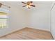 Simple bedroom with light flooring and ceiling fan at 246 Anson Dr, Kissimmee, FL 34758