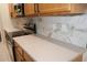 Modern kitchen with stainless steel appliances and light wood cabinetry at 2525 San Tecla St # 101, Orlando, FL 32835