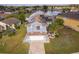 Two-story house with solar panels and lake view at 3279 Fairfield Dr, Kissimmee, FL 34743