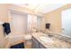 Bathroom with granite countertop and a bathtub at 3279 Fairfield Dr, Kissimmee, FL 34743
